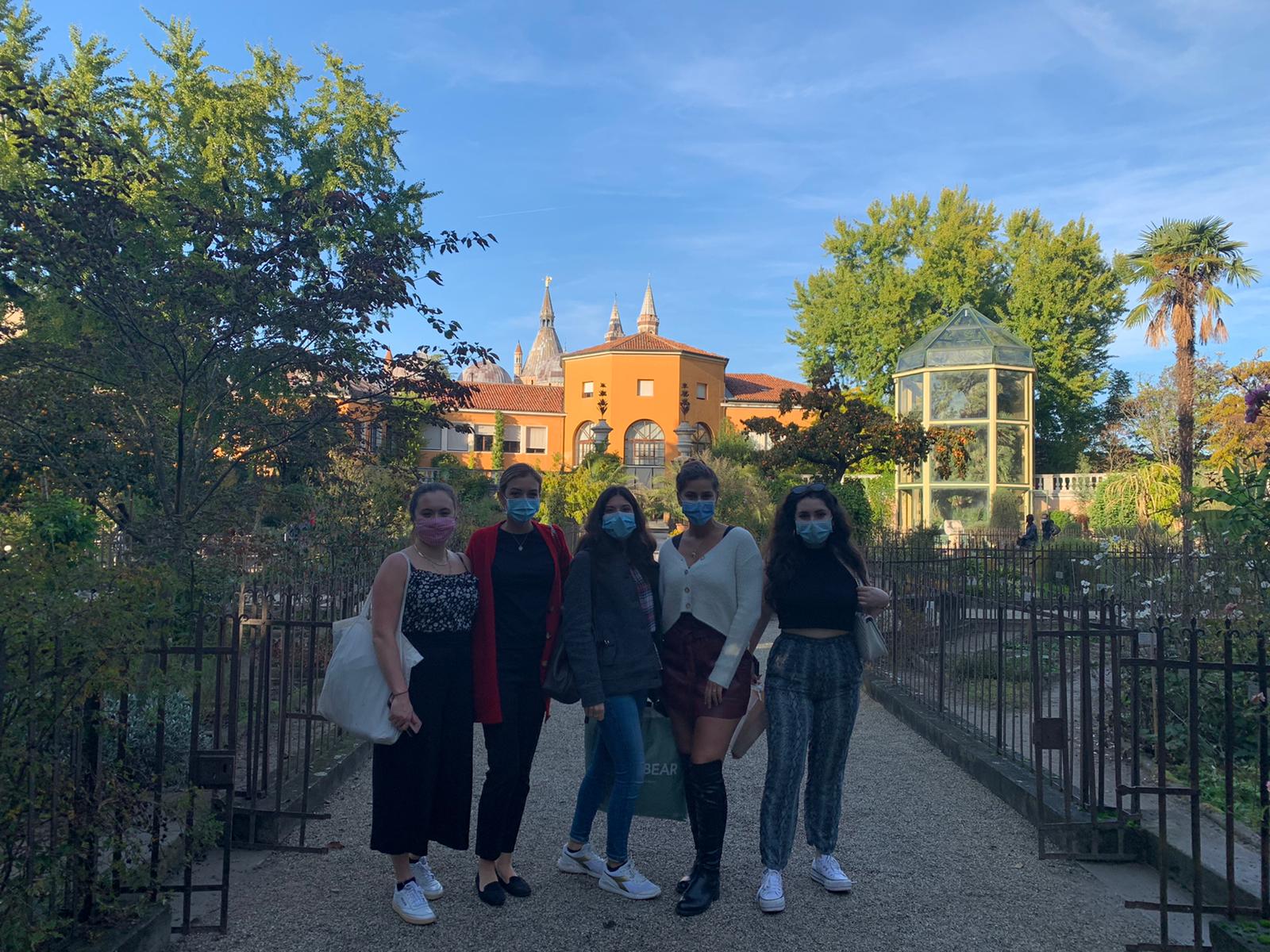 girls standing in botanical park